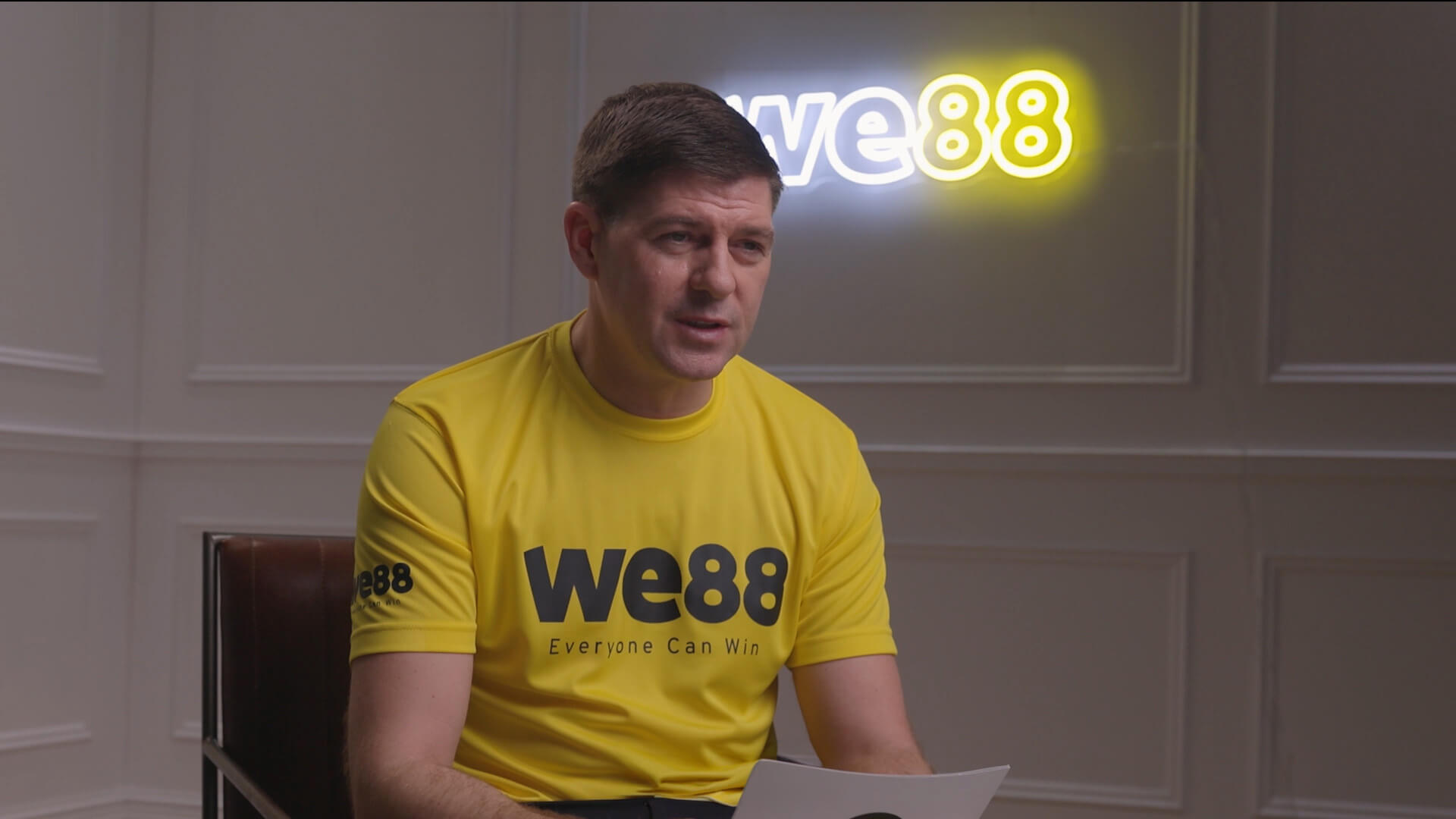 WE88 26/27 Global Brand Ambassador Steven Gerrard holding a script during his behind-the-scenes promotional shoot