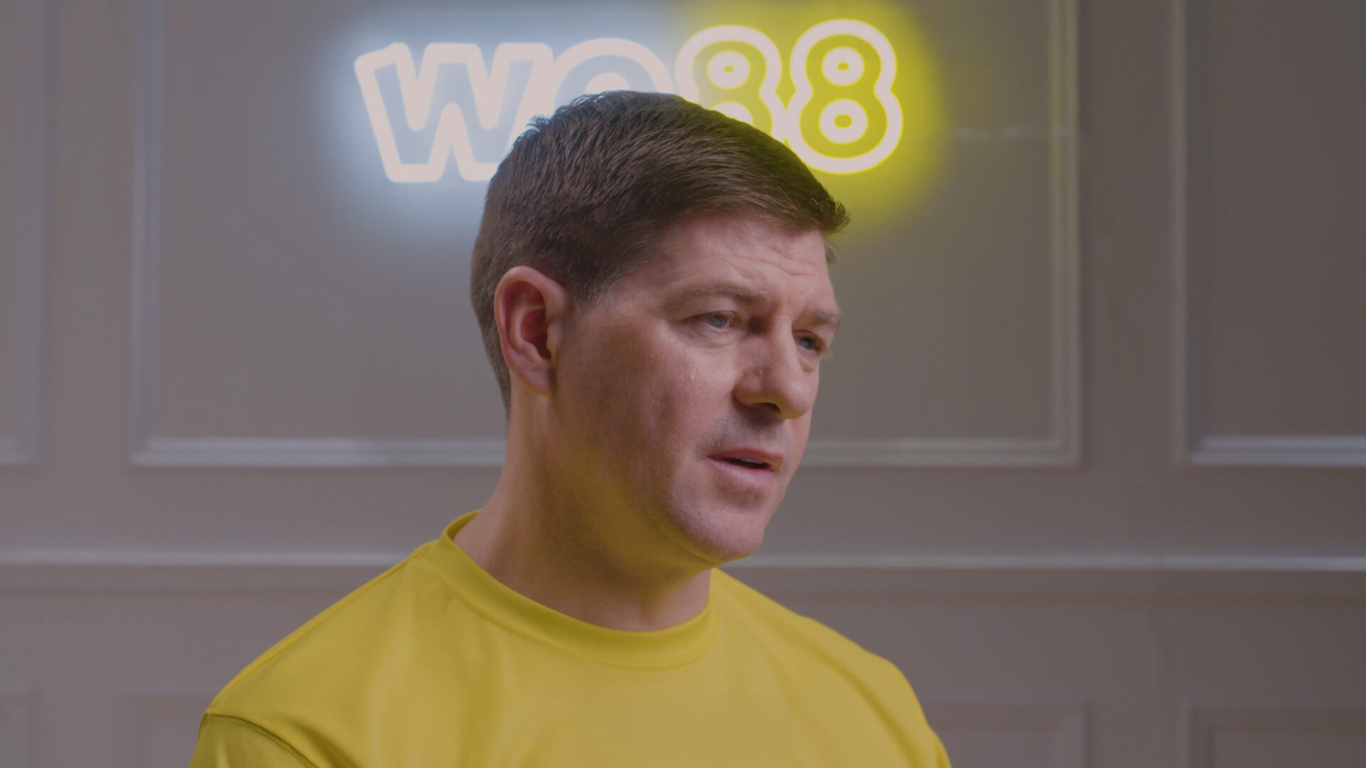 Close-up of WE88 26/27 Global Brand Ambassador Steven Gerrard looking focused during an exclusive behind-the-scenes interview
